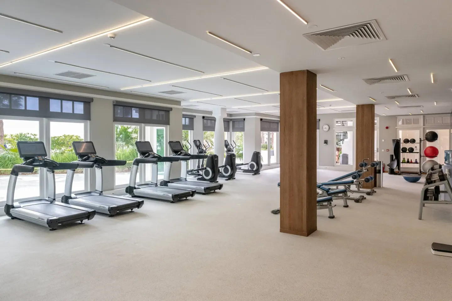 Fitness center with treadmills, benches, and weights at Curacao Marriott Beach Resort.