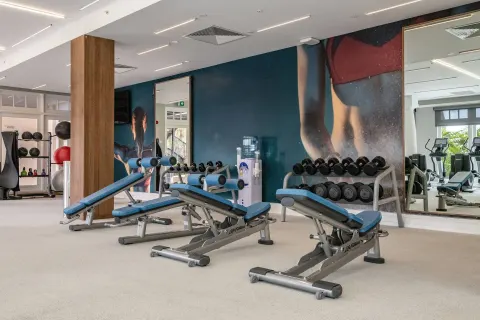 Weight benches and dumbbells in the fitness center at Curacao Marriott Beach Resort.