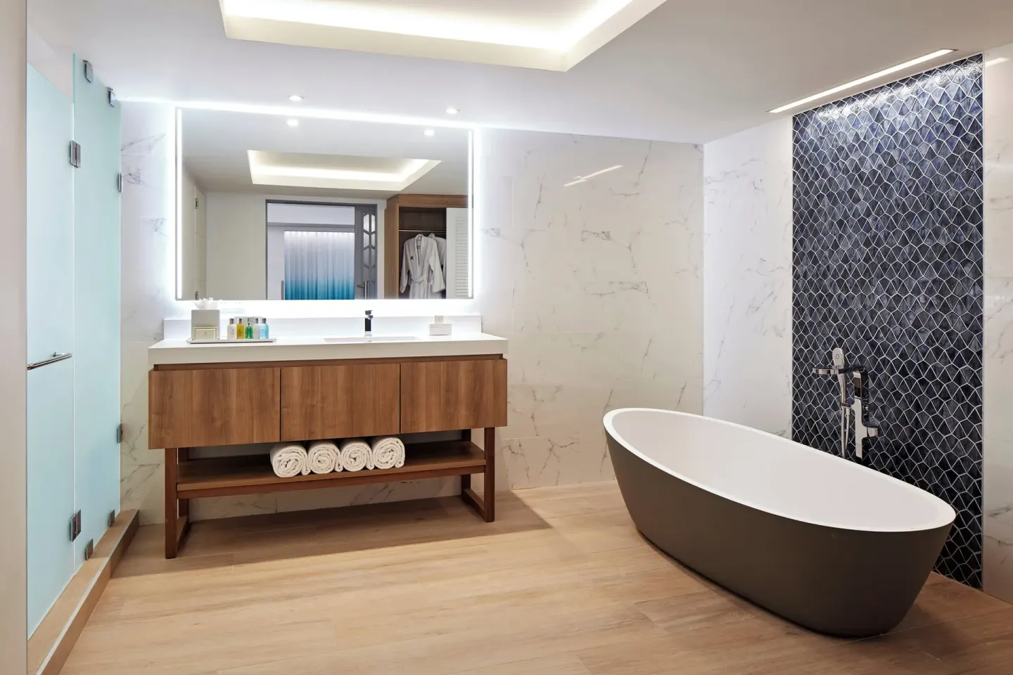 Spacious guest bathroom with freestanding tub at Curacao Marriott Beach Resort.