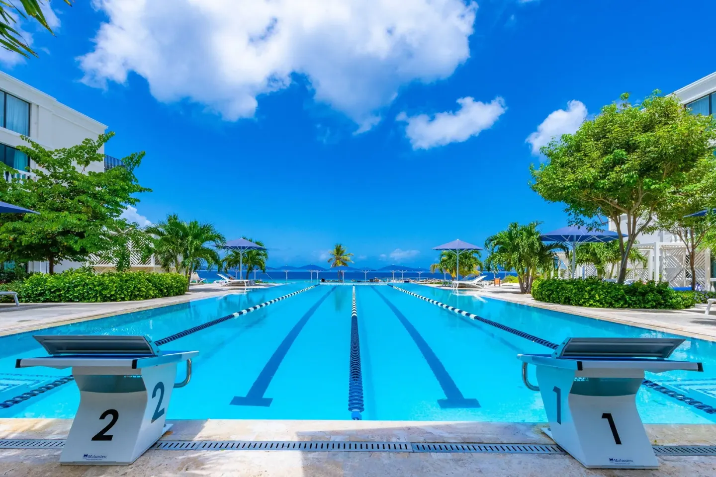 Lap pool with starting blocks and ocean beyond at Curacao Marriott Beach Resort.