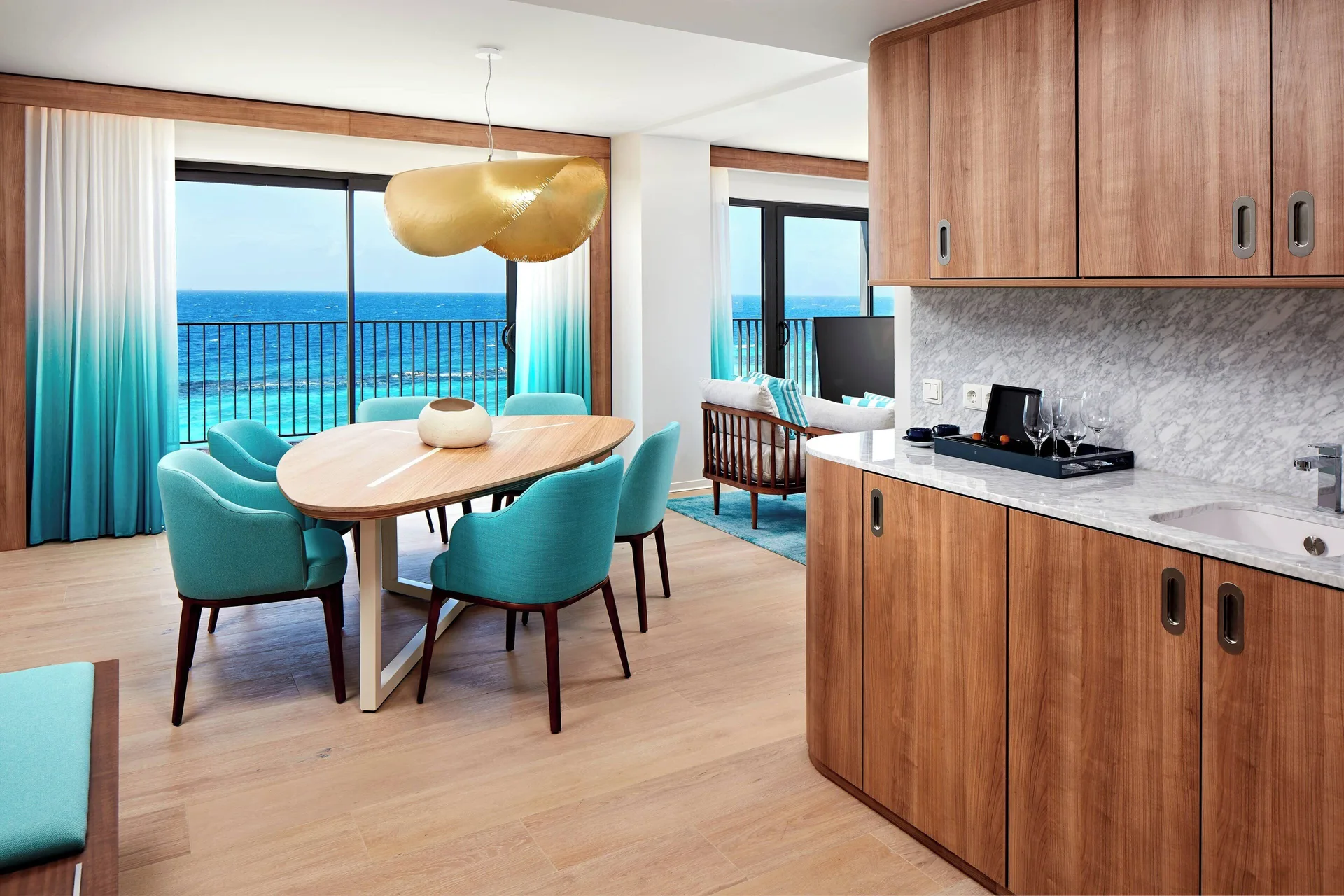 Oceanfront suite dining area and kitchenette at Curacao Marriott Beach Resort.