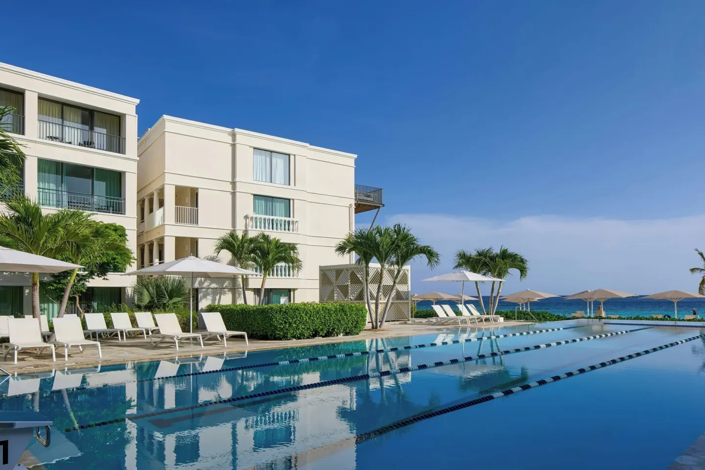 Pool with lap lanes beside guest buildings at Curacao Marriott Beach Resort.