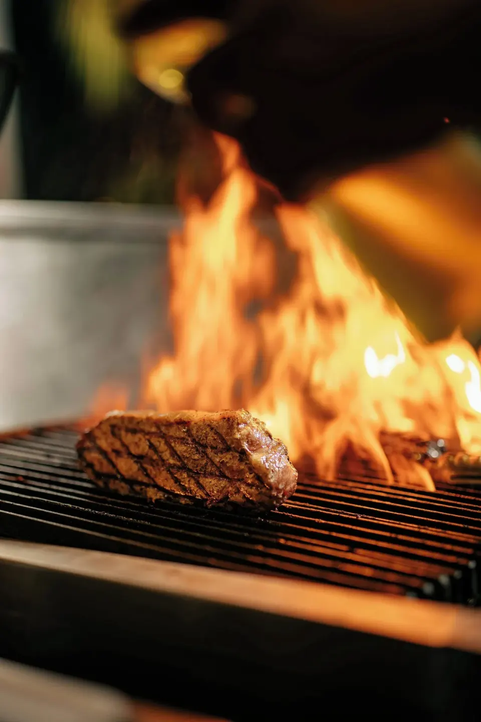 Steak grilling over open flames at Curacao Marriott Beach Resort.