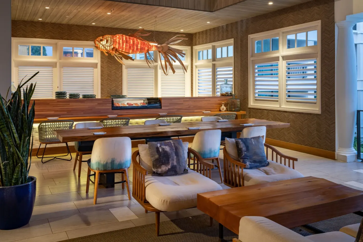 Sushi bar with counter seating and a lobster light fixture at Curacao Marriott Beach Resort.
