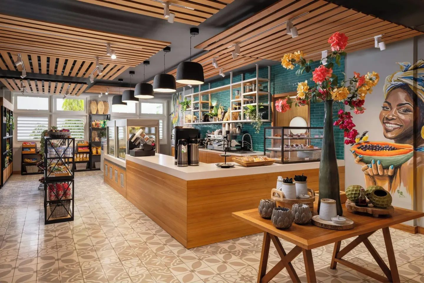 Cafe counter with pastry displays and packaged snacks at Curacao Marriott Beach Resort.