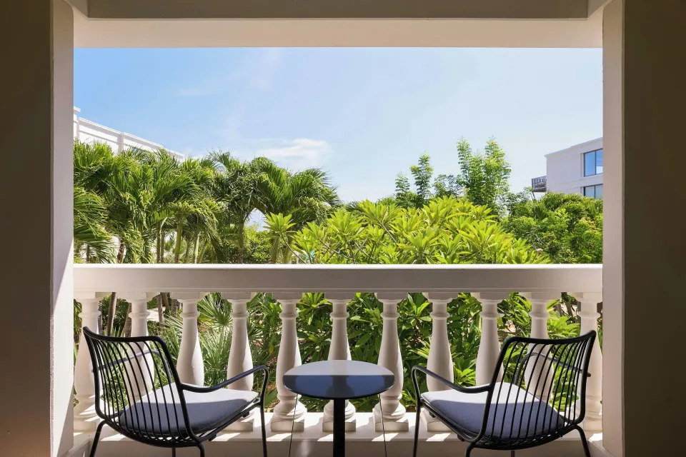 Balcony seating overlooking gardens at Curacao Marriott Beach Resort.