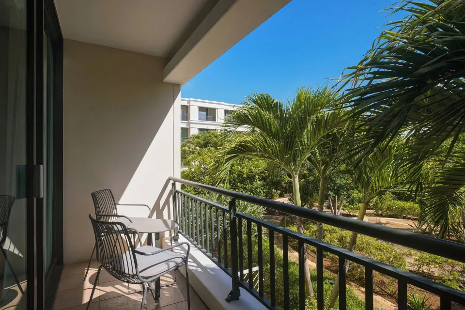 Garden-view balcony with chairs at Curacao Marriott Beach Resort.