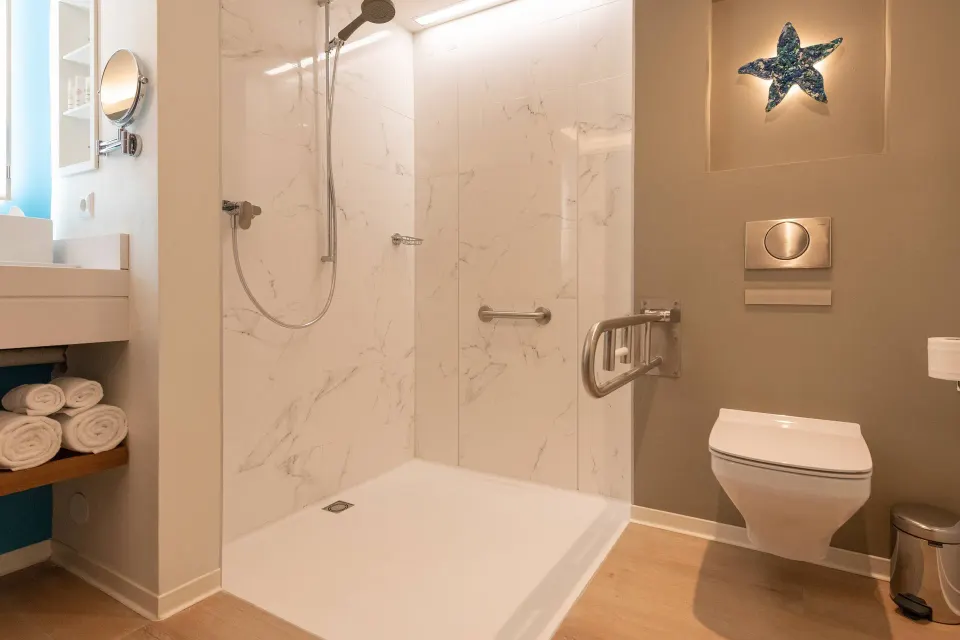 Accessible bathroom with walk-in shower in a room at Curacao Marriott Beach Resort.