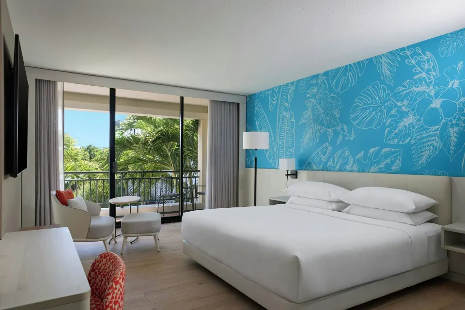 King guest room with balcony garden view at Curacao Marriott Beach Resort.