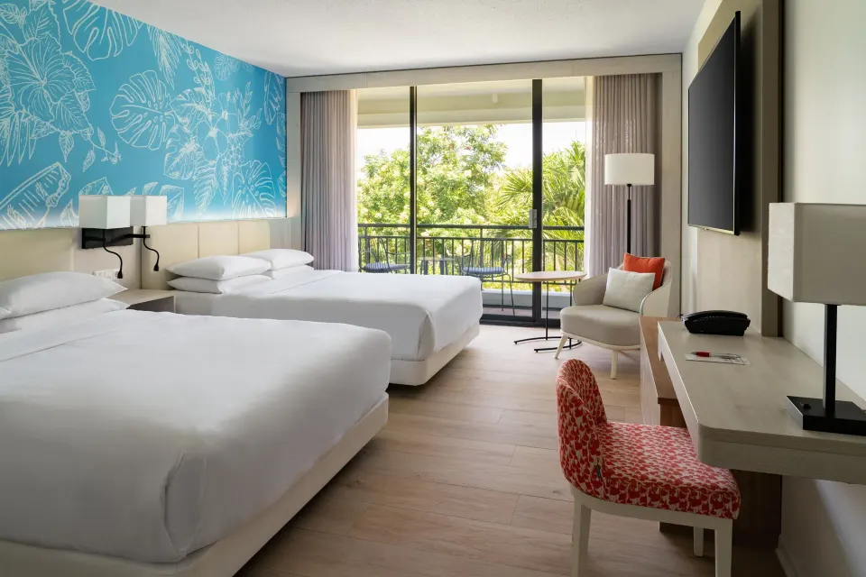 Two-bed garden-view room with balcony at Curacao Marriott Beach Resort.