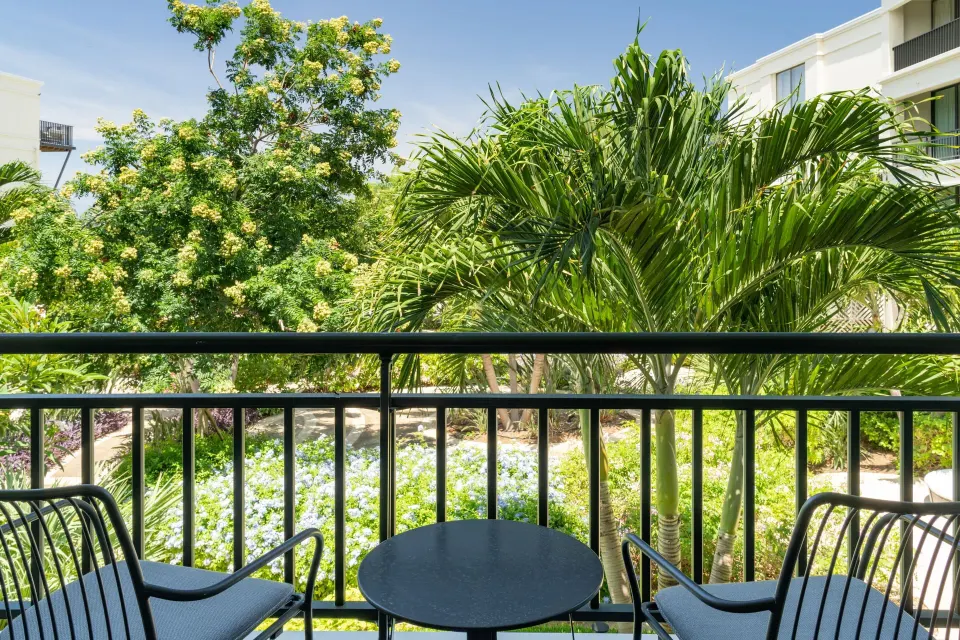 Balcony seating overlooking tropical landscaping at Curacao Marriott Beach Resort.