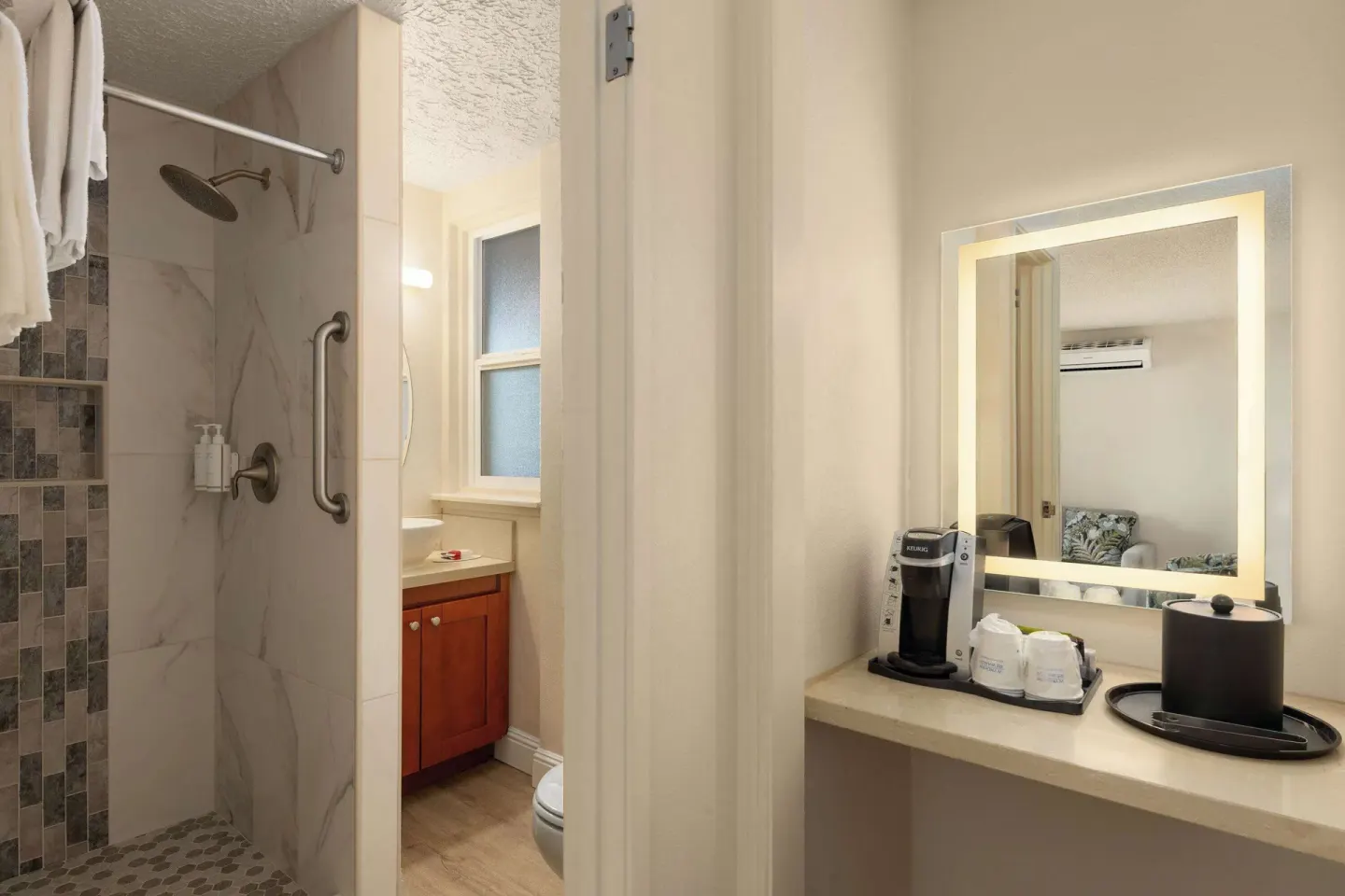 Bathroom vanity and walk-in shower at Days Inn Maui Oceanfront.