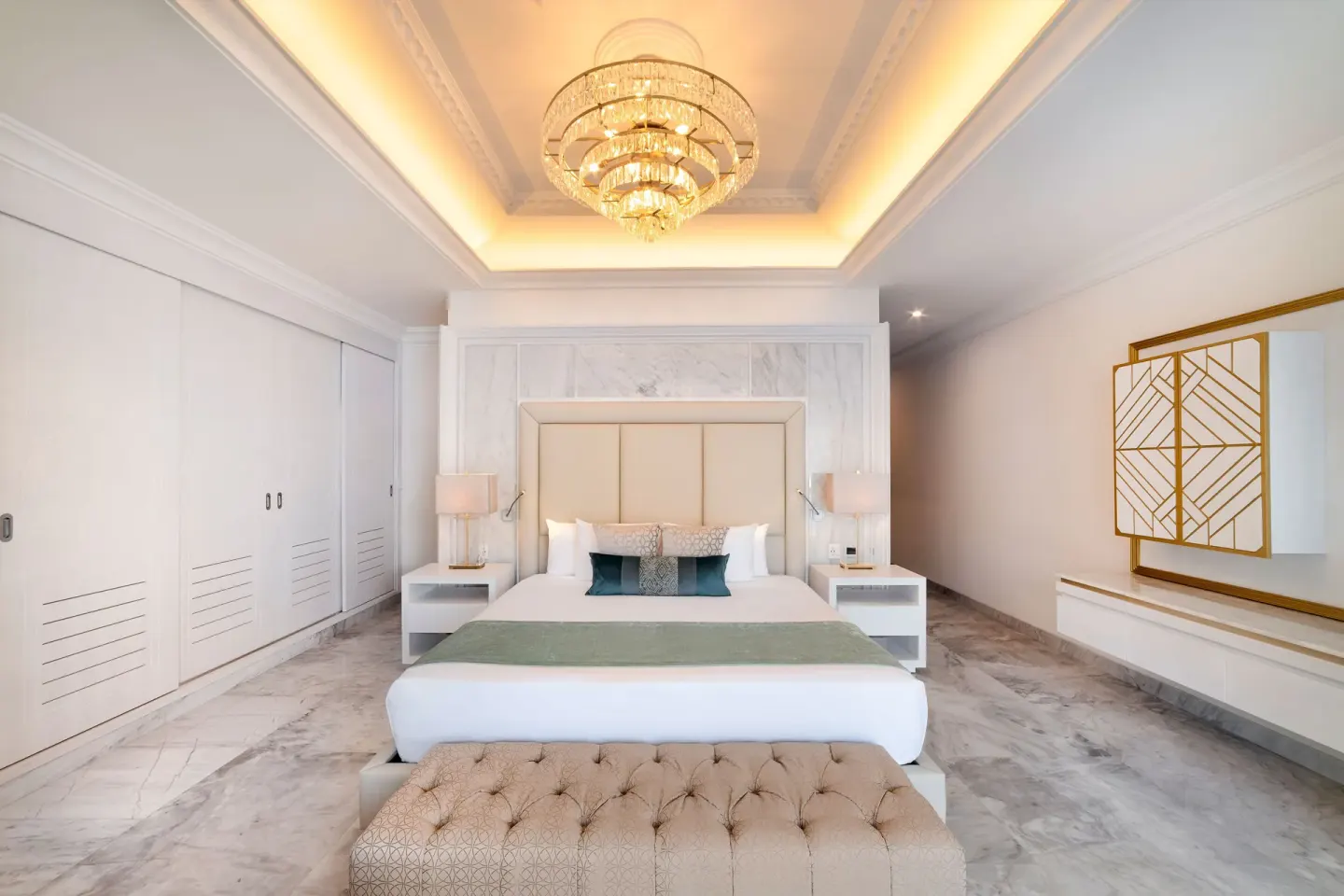 Mansion Jacuzzi Suite king bed with tufted bench at Desire Pearl Riviera Maya Resort.