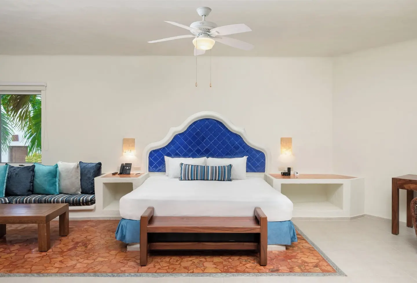 Master Suite with Plunge Pool king bed and blue headboard at Desire Pearl Riviera Maya Resort.