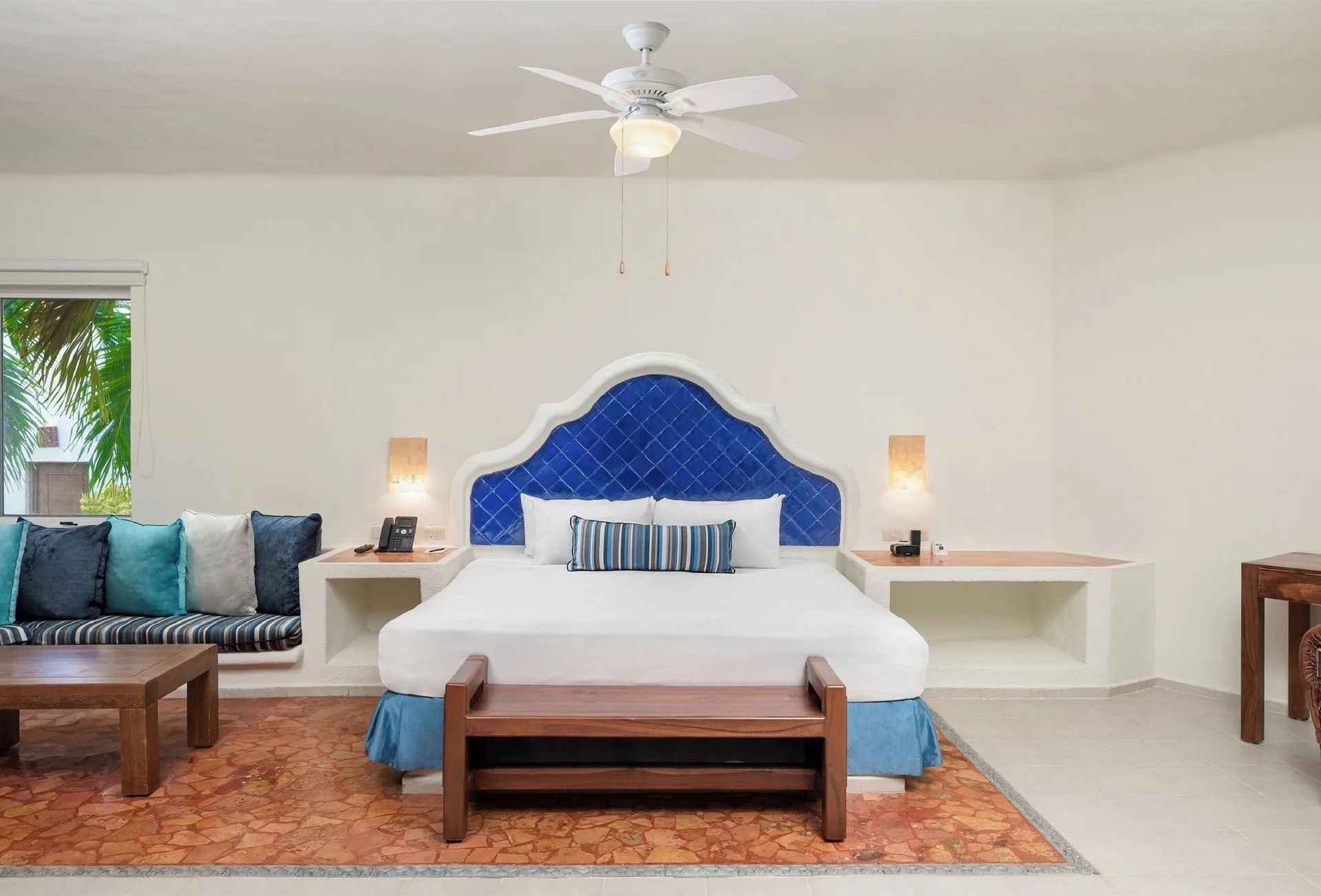 Master Suite with Plunge Pool king bed and blue headboard at Desire Pearl Riviera Maya Resort.