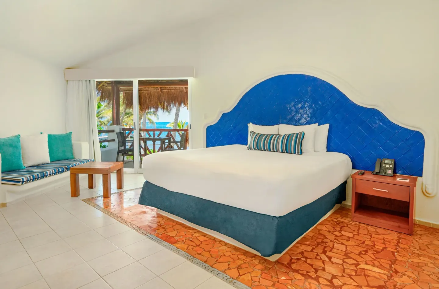 Ocean View room with king bed and balcony at Desire Pearl Riviera Maya Resort.