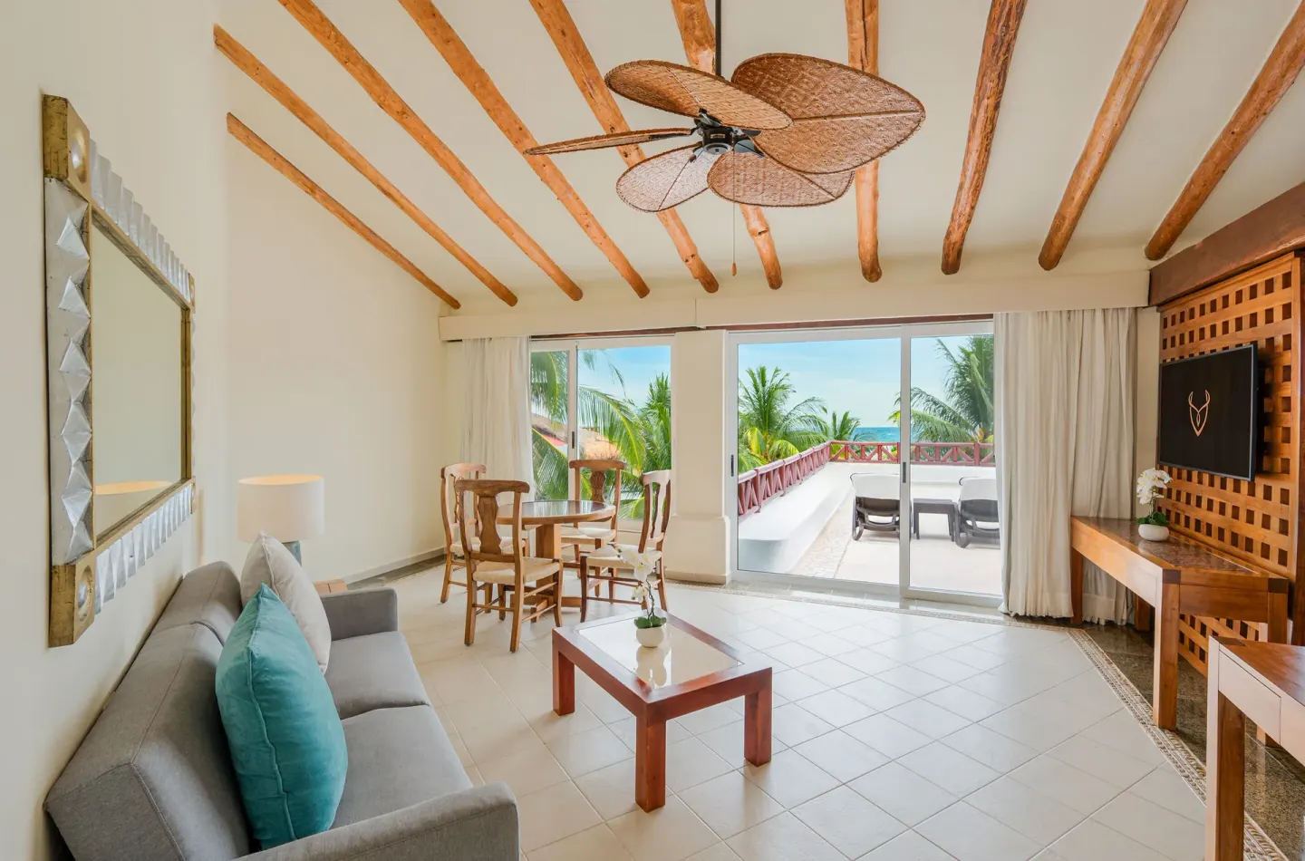Penthouse Passion Suite living room and terrace at Desire Pearl Riviera Maya Resort.