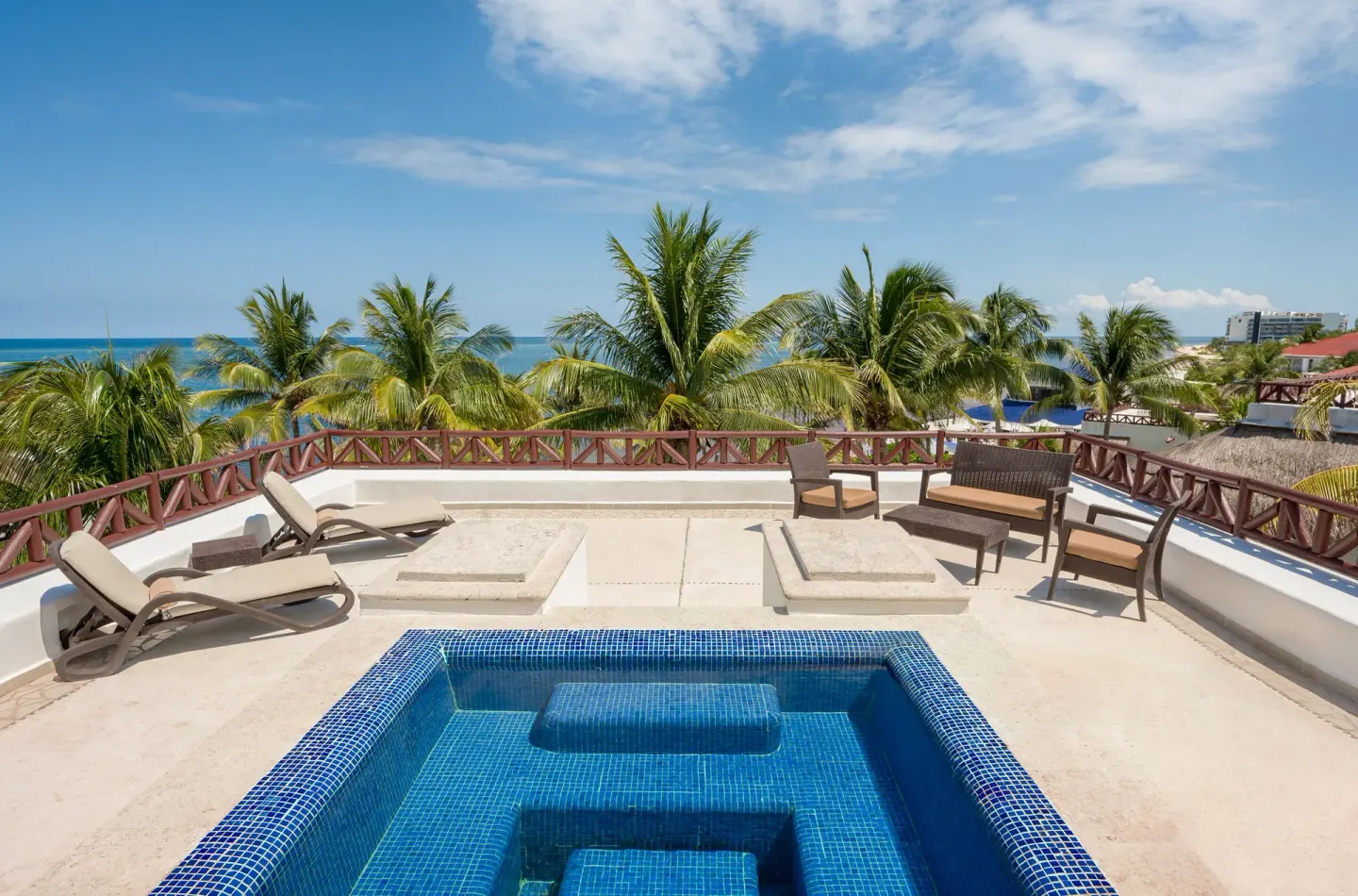 Penthouse Passion Suite terrace plunge pool at Desire Pearl Riviera Maya Resort with ocean and palms.