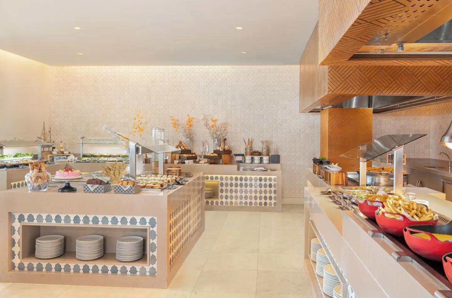 Buffet stations with hot dishes and desserts at Desire Riviera Maya Resort.