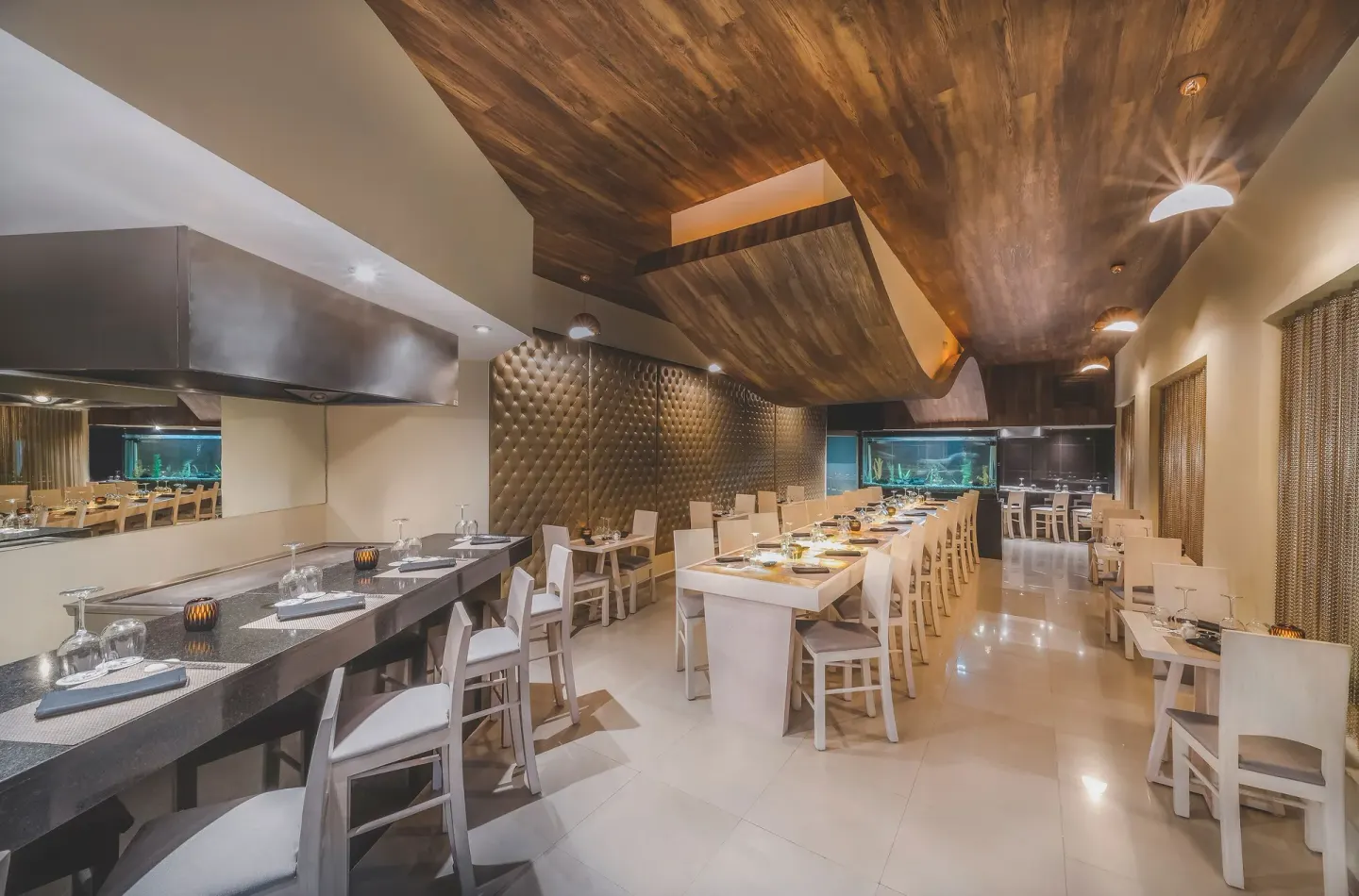 Teppanyaki-style dining room with long grill tables at Desire Riviera Maya Resort.