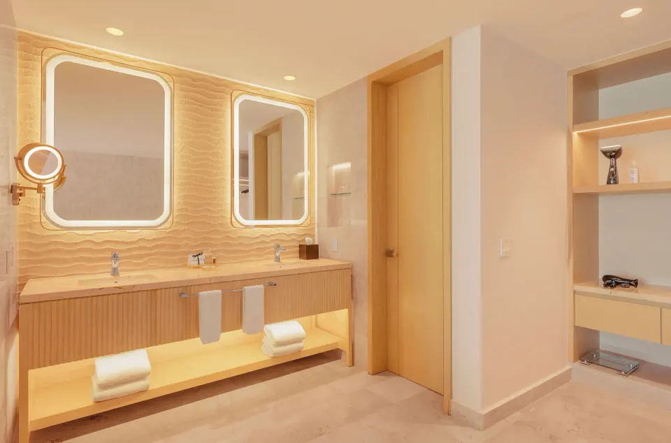 Beloved Tropical-View Jacuzzi Suite bathroom vanity with double sinks at Desire Riviera Maya Resort.