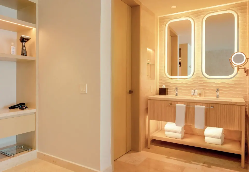 Beloved Tropical View Swim-Up Suite bathroom vanity at Desire Riviera Maya Resort.