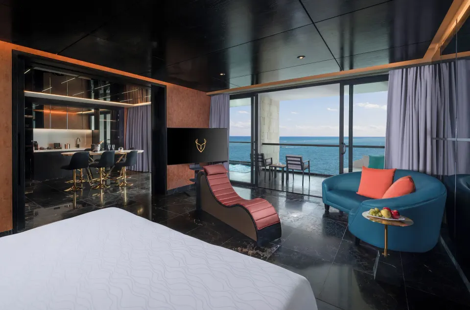 Diamond Ocean View Jacuzzi Suite king bed, balcony and ocean view at Desire Riviera Maya Resort.