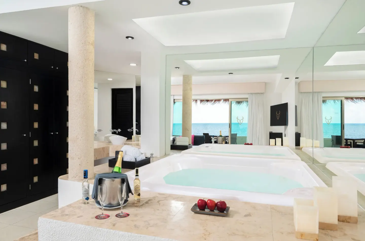 Passion Suite with indoor soaking tub and ocean view at Desire Riviera Maya Resort.