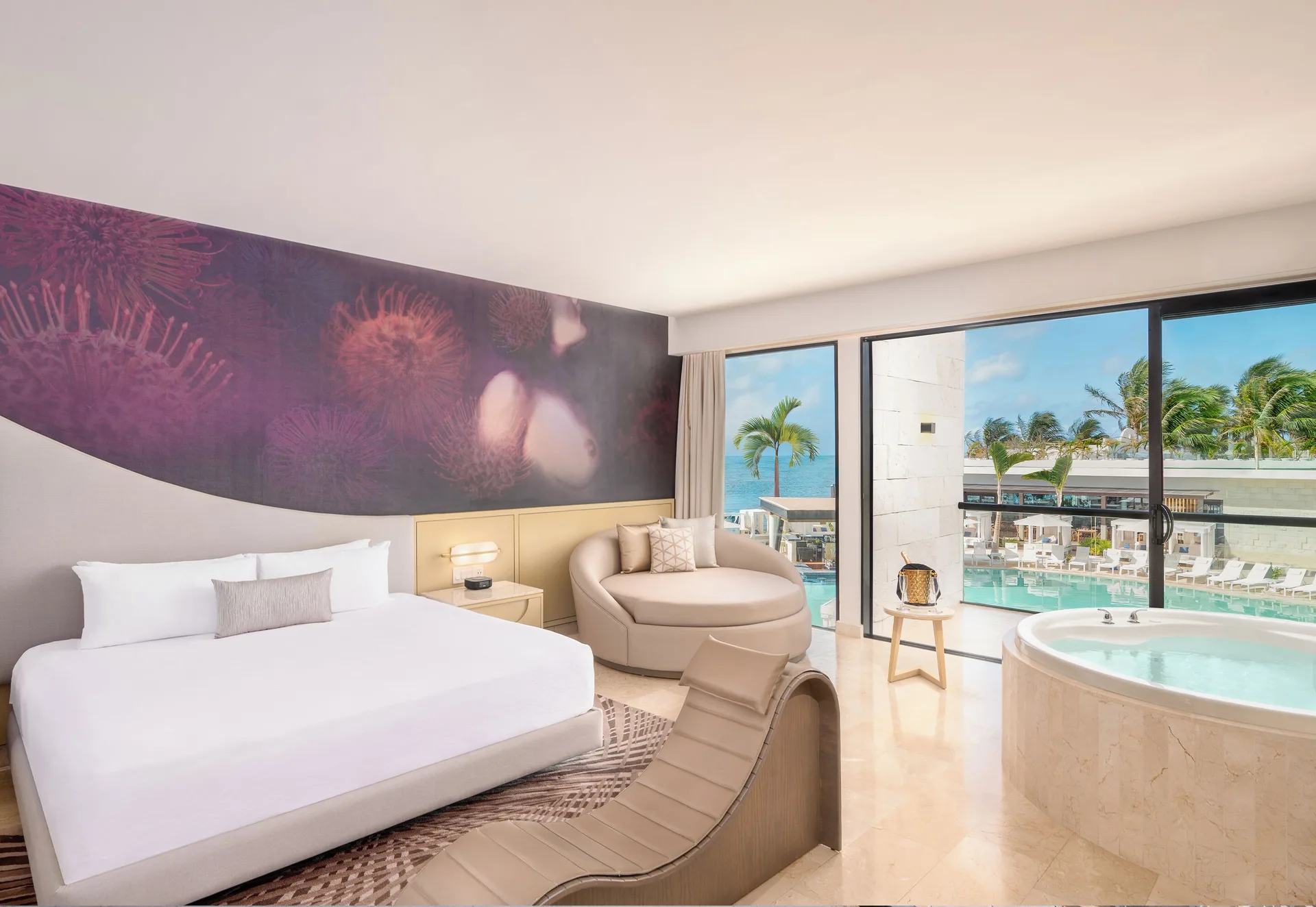 Seductive Pool View Jacuzzi Suite with king bed and in-room tub at Desire Riviera Maya Resort.