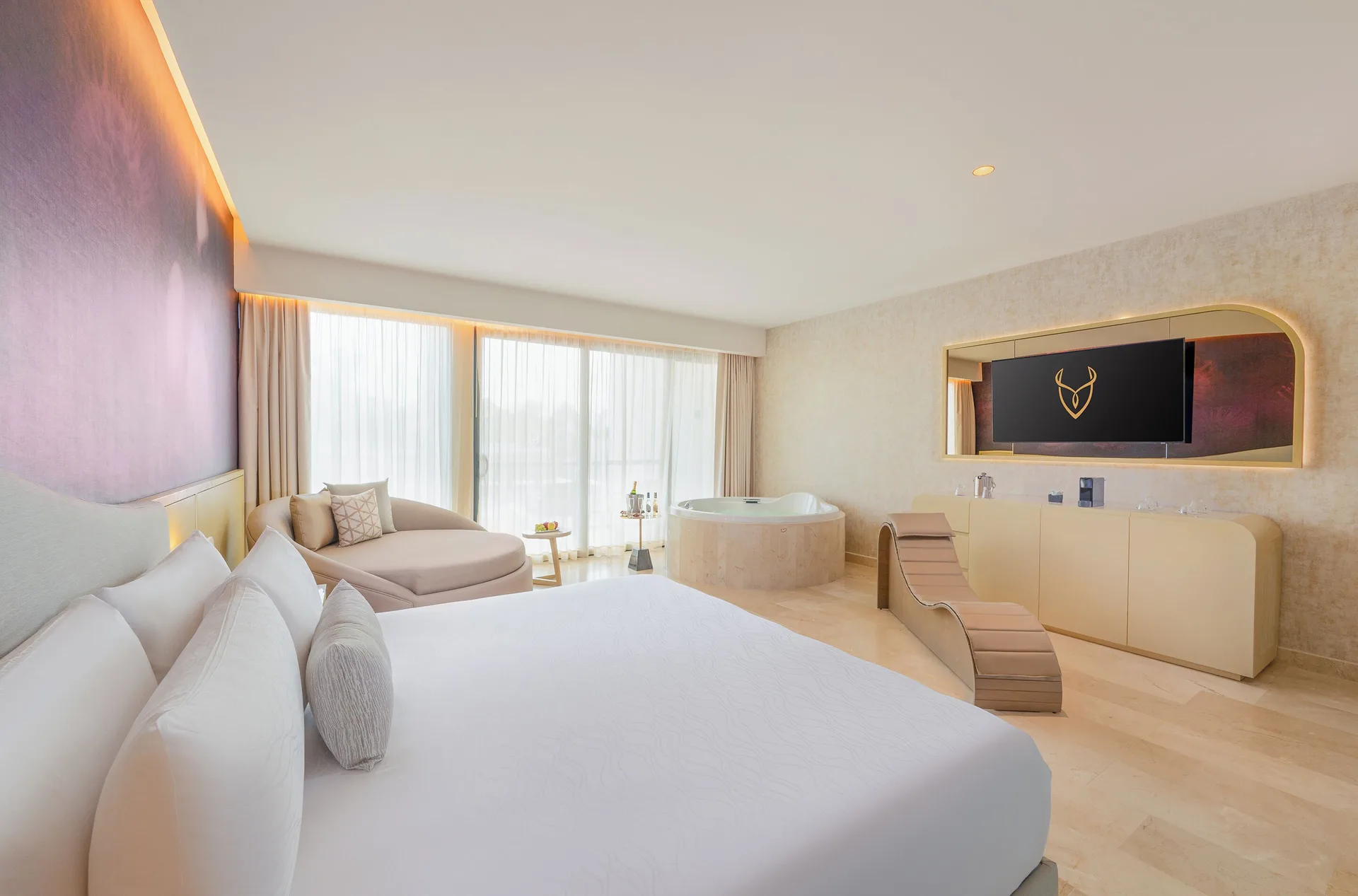 Seductive Pool View Jacuzzi Suite with king bed, TV wall, and round tub at Desire Riviera Maya Resort.
