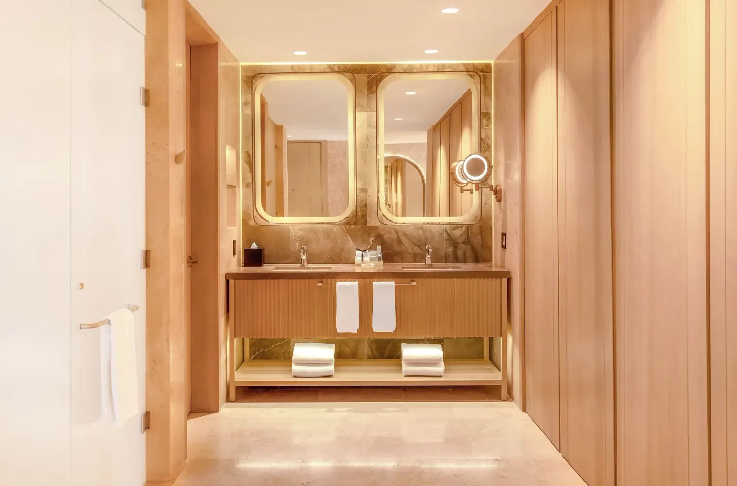 Double-sink bathroom vanity with backlit mirrors at Desire Riviera Maya Resort.