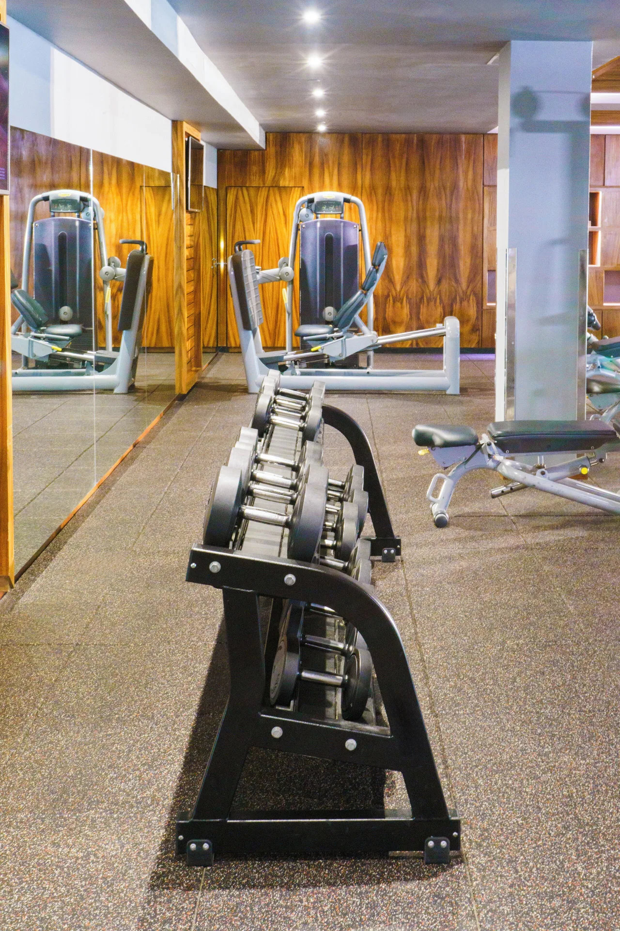 Fitness center dumbbell rack at Devossion By Live Aqua Playa del Carmen.