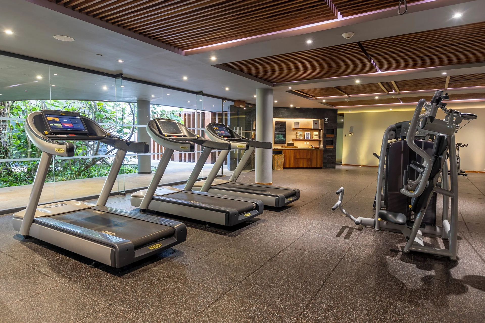 Fitness center treadmills at Devossion By Live Aqua Playa del Carmen.
