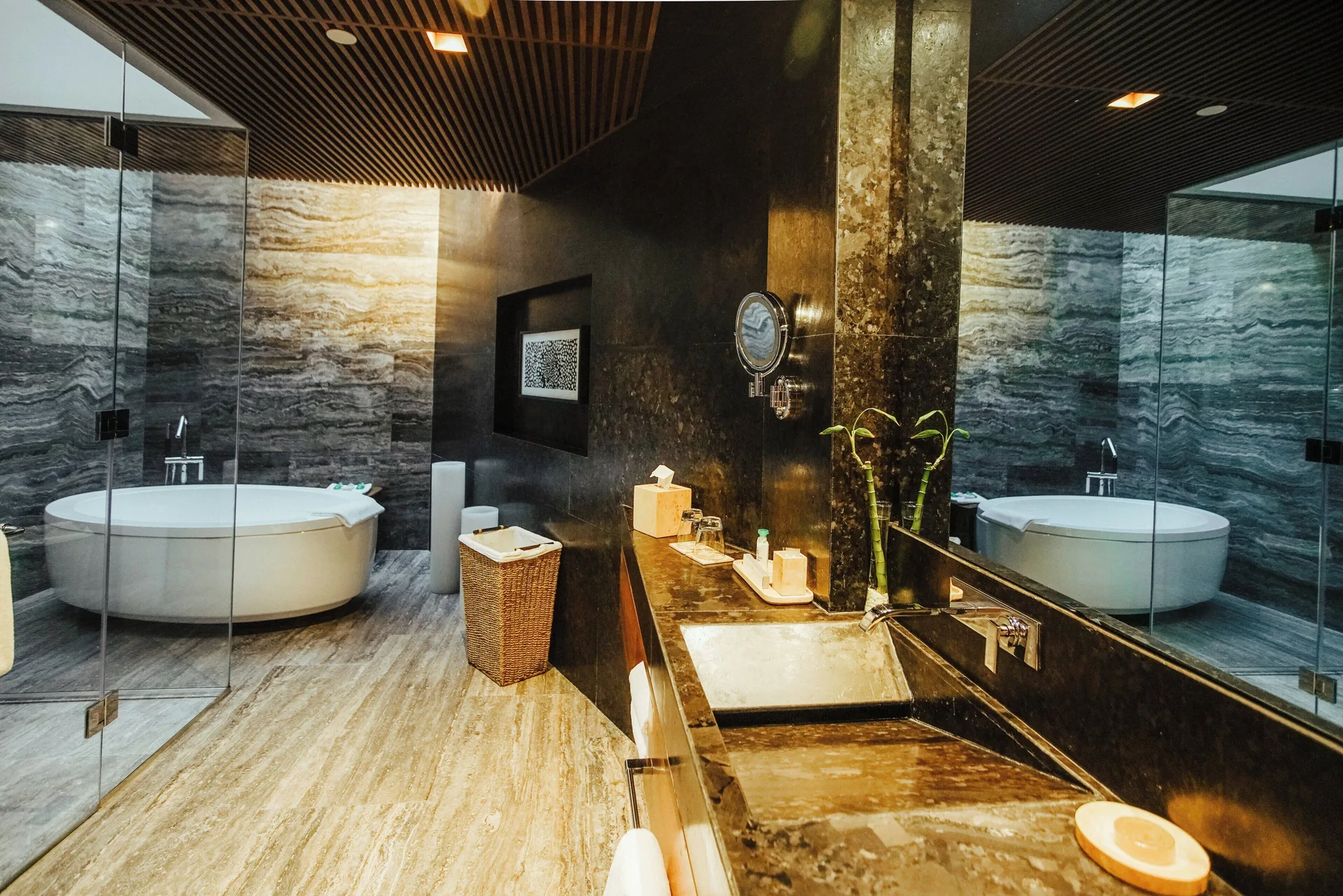 Guest bathroom with soaking tub at Devossion By Live Aqua Playa del Carmen.