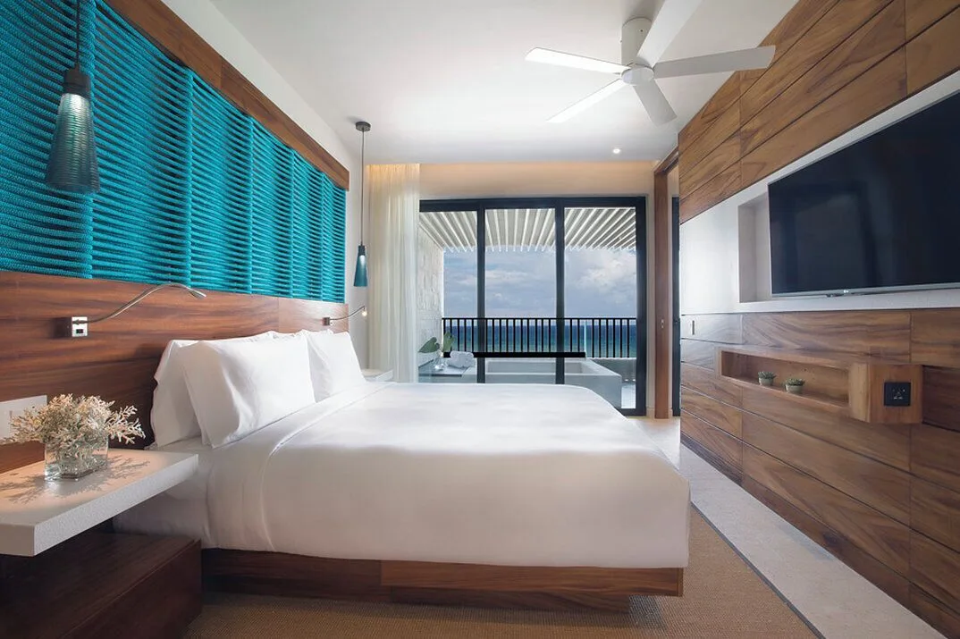 King guest room with balcony tub and ocean view at Devossion By Live Aqua Playa del Carmen.