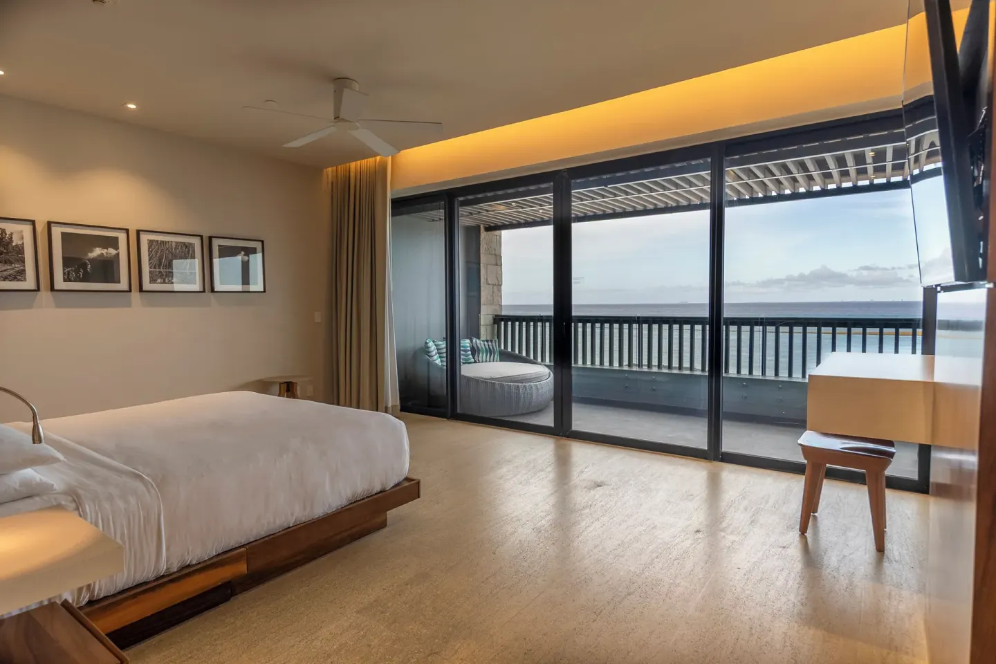 Guest room with king bed, balcony, and ocean view at Devossion By Live Aqua Playa del Carmen.
