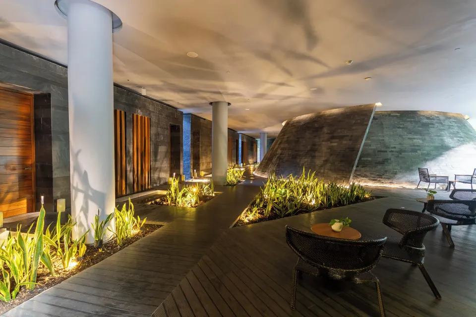 Spa corridor and seating area at Devossion By Live Aqua Playa del Carmen.