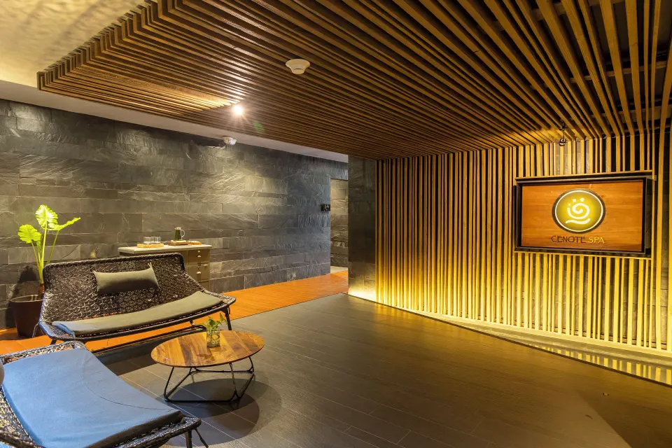 Spa lounge with Cenote Spa sign at Devossion By Live Aqua Playa del Carmen.