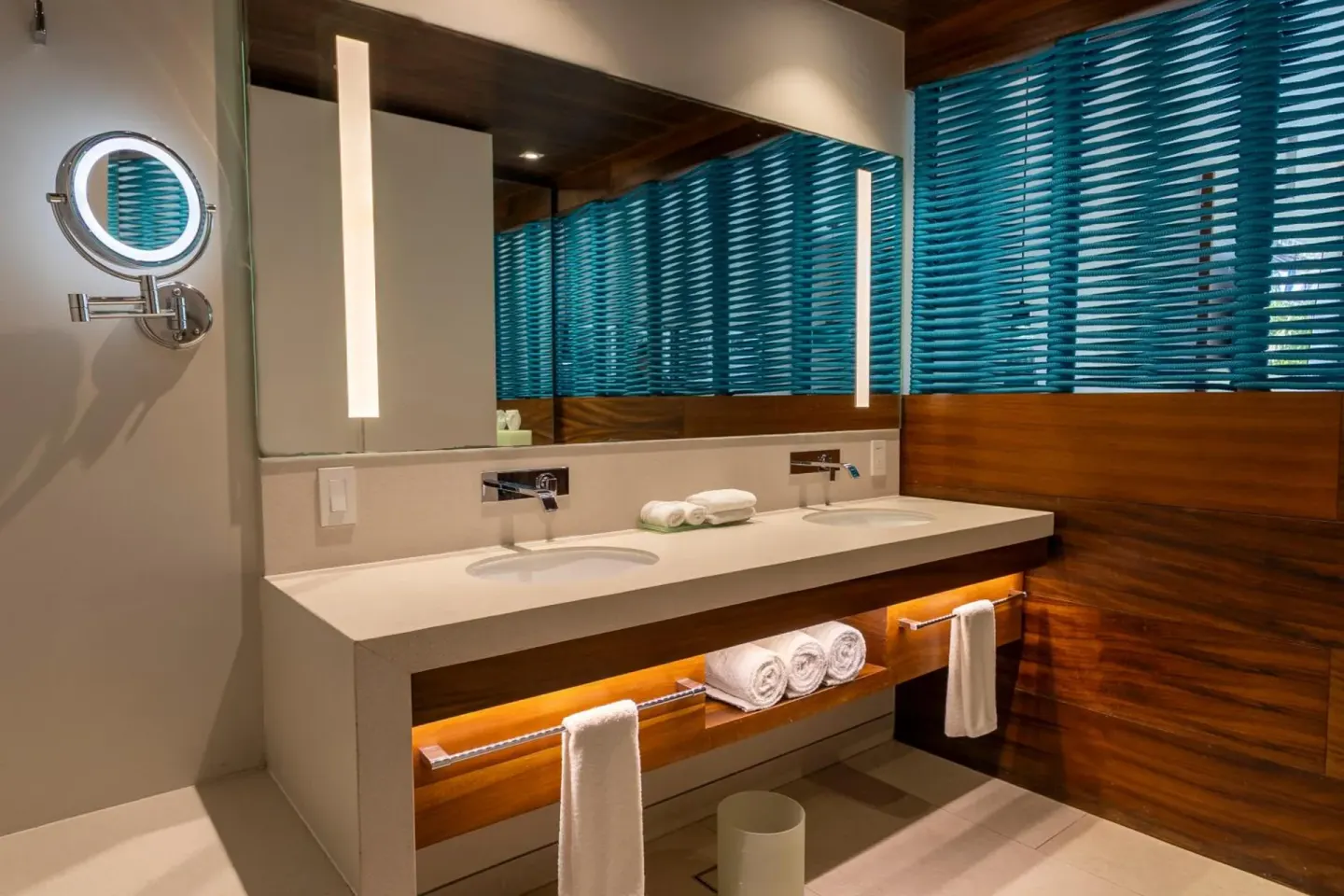 Premium Garden View bathroom vanity with blue blinds at Devossion By Live Aqua Playa del Carmen.