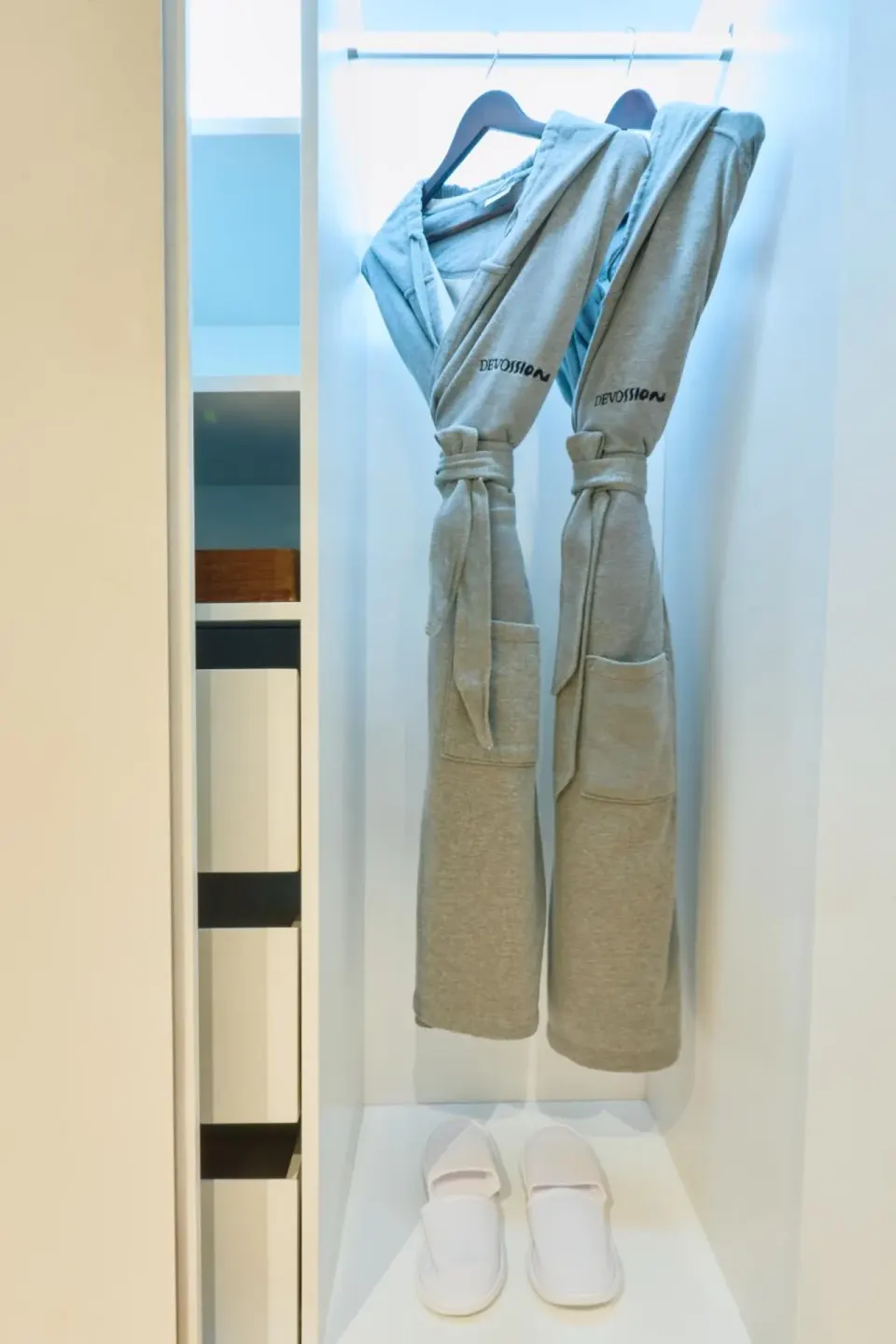 Premium Garden View closet with robes and slippers at Devossion By Live Aqua Playa del Carmen.