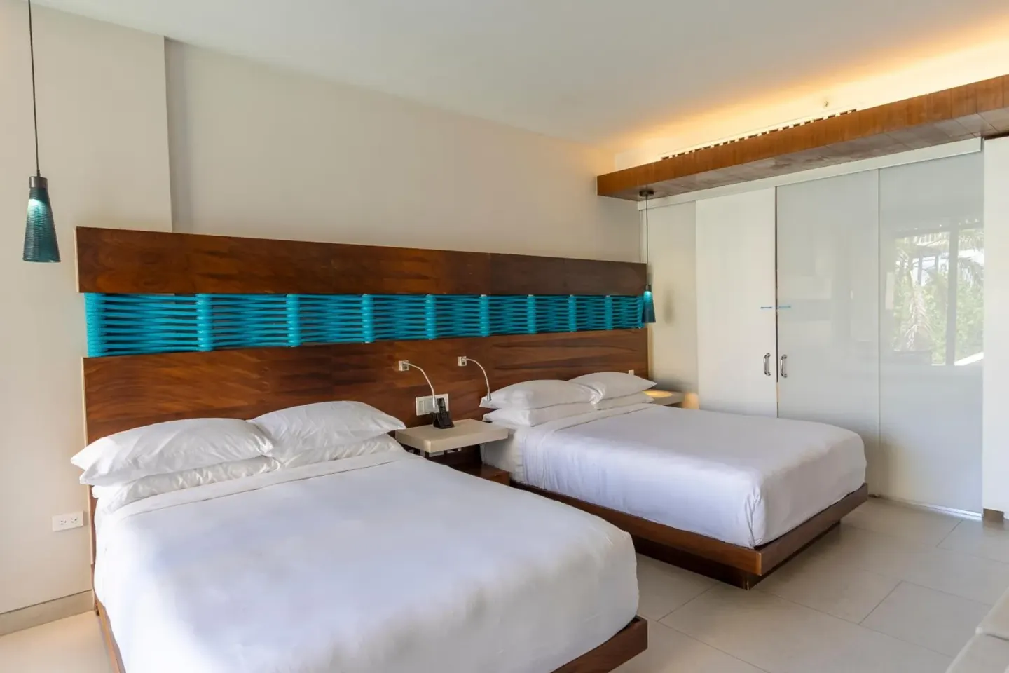 Premium Garden View room with two beds at Devossion By Live Aqua Playa del Carmen.