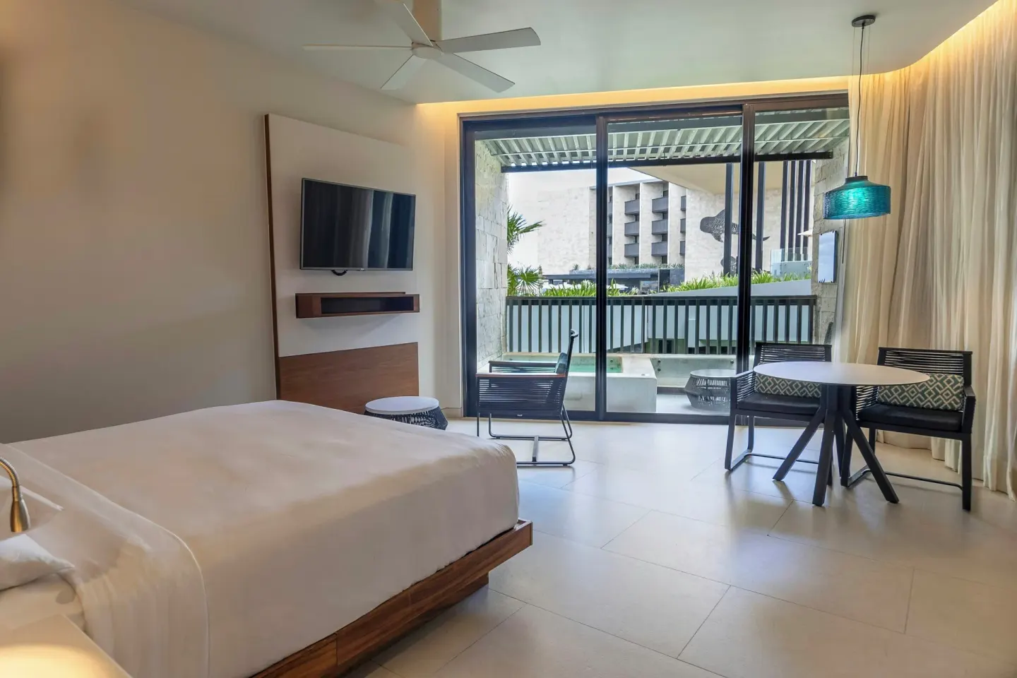 Premium Room king bed with terrace and plunge pool at Devossion By Live Aqua Playa del Carmen.