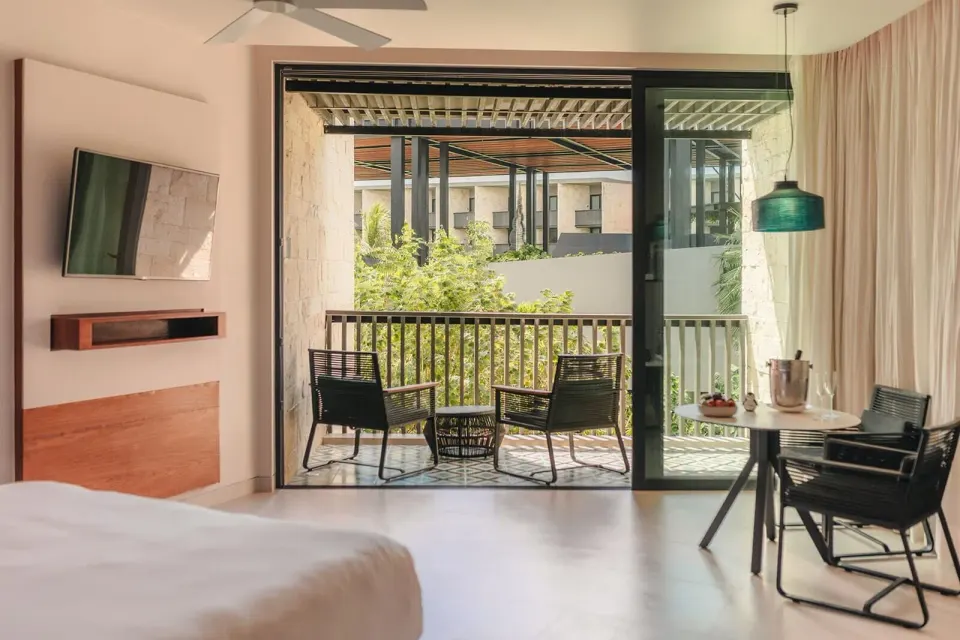 Premium Room with balcony seating at Devossion By Live Aqua Playa del Carmen.