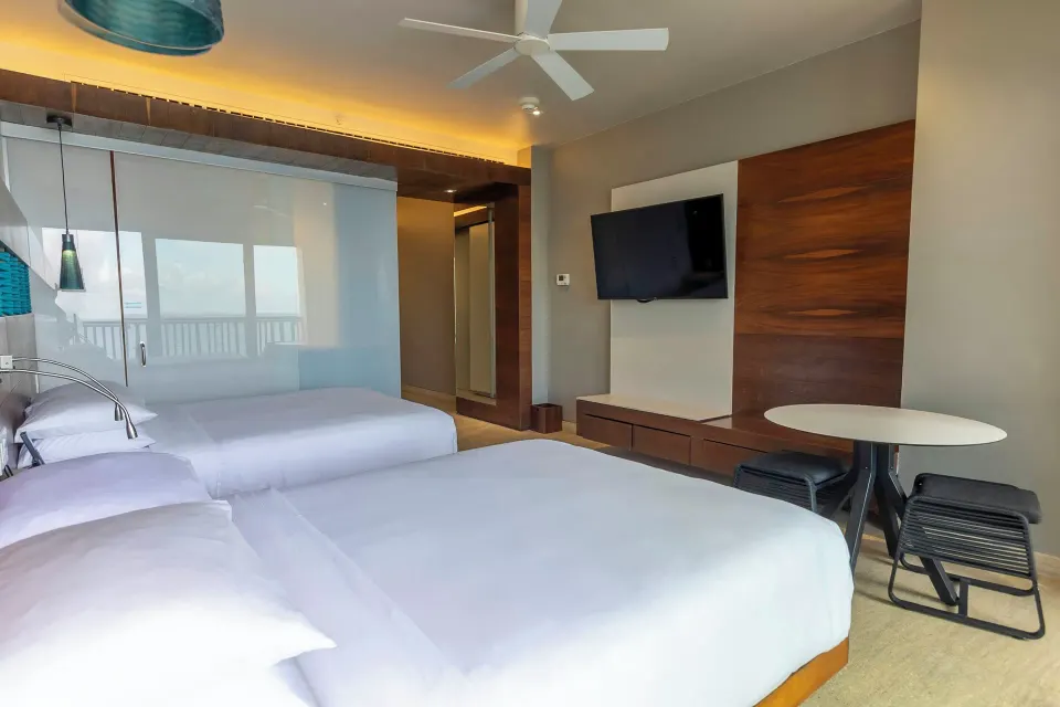 Premium Room with two double beds and wall-mounted TV at Devossion By Live Aqua Playa del Carmen.