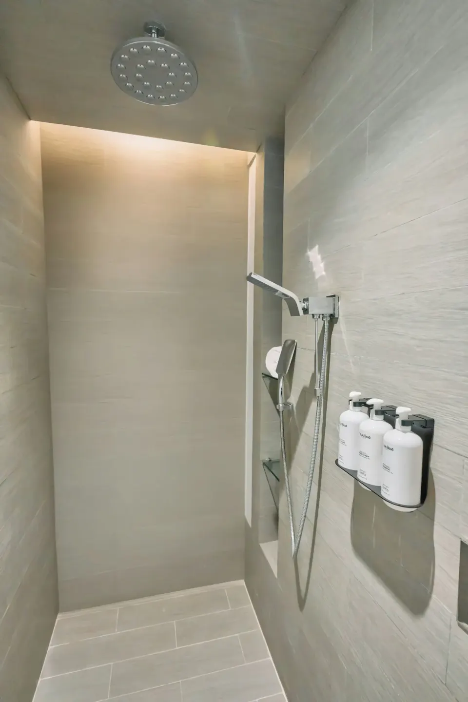 Walk-in shower in a Premium Room at Devossion By Live Aqua Playa del Carmen.