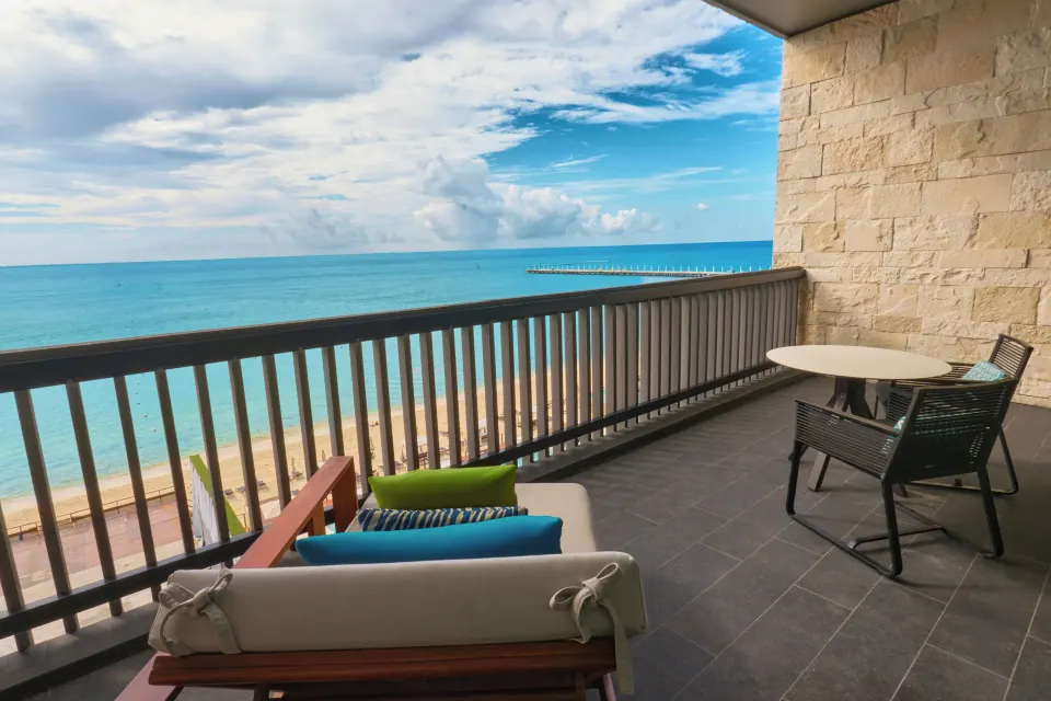 Oceanfront Premium Room balcony with lounge seating at Devossion By Live Aqua Playa del Carmen.