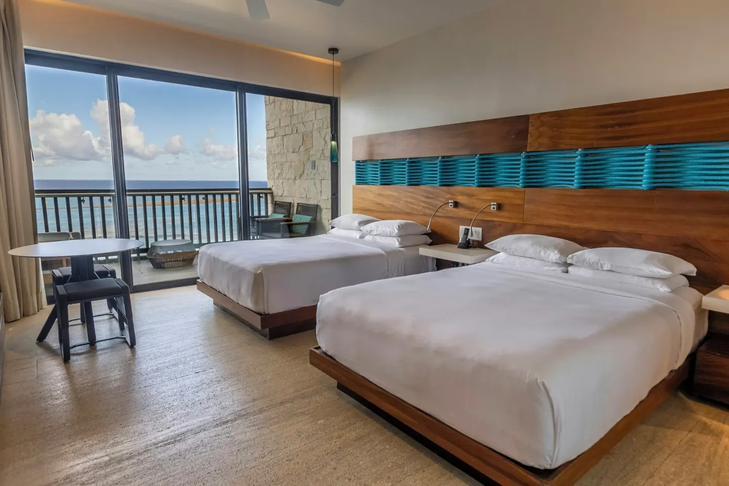 Premium Room with two beds and oceanfront balcony at Devossion By Live Aqua Playa del Carmen.