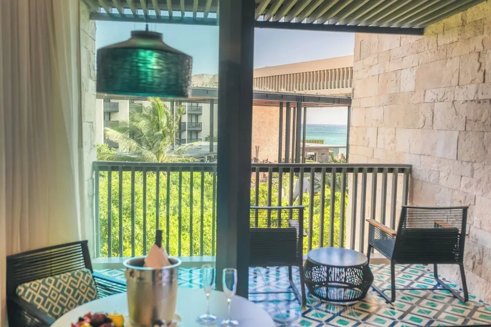 Premium Room balcony and partial ocean view at Devossion By Live Aqua Playa del Carmen.