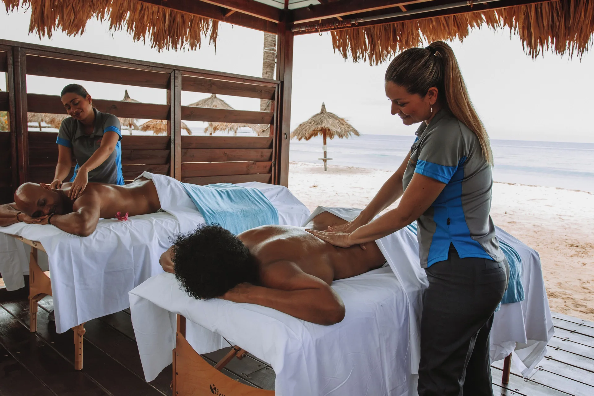 Beachside massage cabana with two guests at Divi Aruba Phoenix Beach Resort.