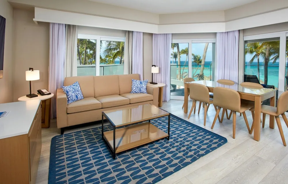 Oceanview living and dining area in a suite at Divi Aruba Phoenix Beach Resort.